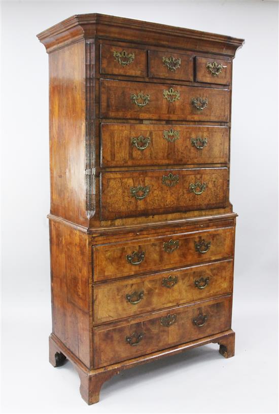 A George II crossbanded walnut chest on chest, W.3ft 8in. D.1ft 11in. H.6ft 6in.